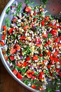 farro salad with roasted corn, diced red peppers and cilantro