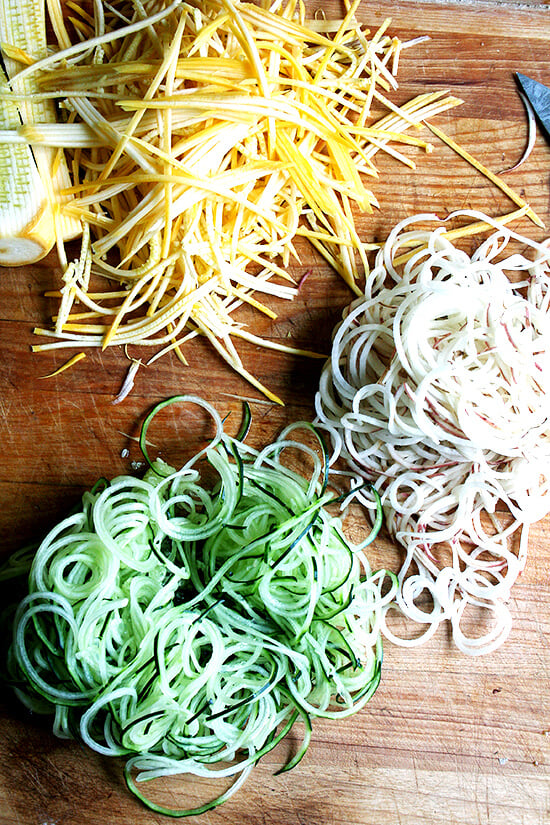 sliced cucumbers, potatoes and summer squash