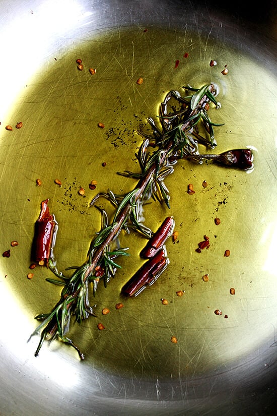 rosemary and chile de arbol sizzling in olive oil rosemary and chile de arbol sizzling in olive oil