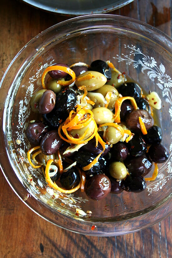 tossing olives with marinade